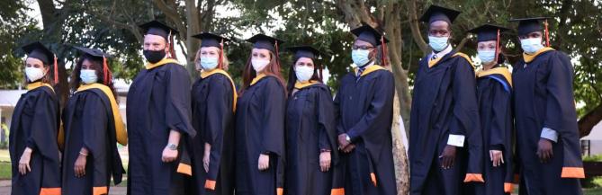 row of graduate students in caps and gowns